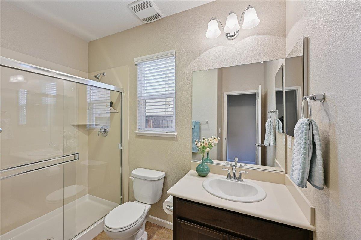 706 Wagon Trail Way Rocklin, CA 95765 - Photo 23 of 61 a bathroom with a sink a toilet and shower