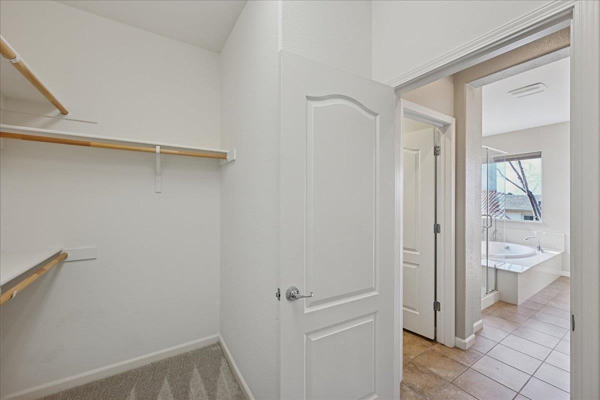 706 Wagon Trail Way Rocklin, CA 95765 - Photo 44 of 61 a view of a hallway with wooden floor and a bathroom
