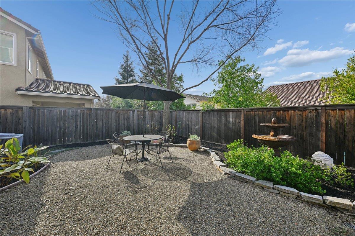 706 Wagon Trail Way Rocklin, CA 95765 - Photo 50 of 61 a backyard of a house with table and chairs