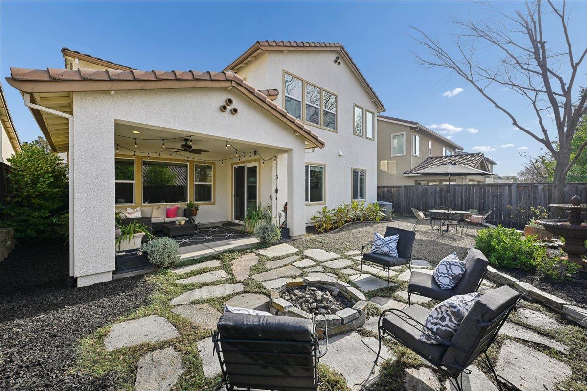 706 Wagon Trail Way Rocklin, CA 95765 - Photo 54 of 61 a view of a patio with couches table and chairs with wooden fence