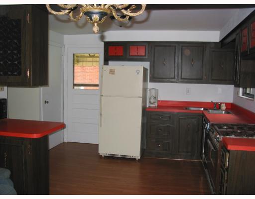 5203 Ranchview Drive Baldwin, PA 15236 - Photo 3 of 10 Kitchen. Door leads to the side porch and rear yard. Access to gameroom. Lots of cabinets and counter space. Breakfast bar, refrigerator remains. New laminate floor installed Sept. of 09.
