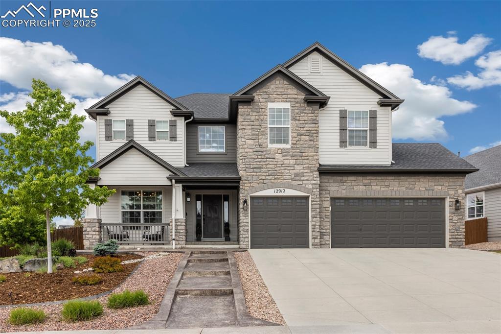 a front view of a house with yard