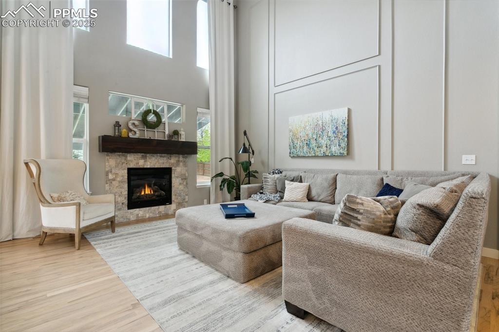 12912 Fishers Island Road Peyton, CO 80831 - Photo 11 of 45 a living room with furniture and a fireplace