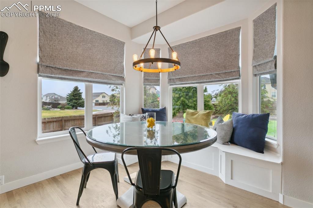 12912 Fishers Island Road Peyton, CO 80831 - Photo 13 of 45 a dining room with furniture window and outside view
