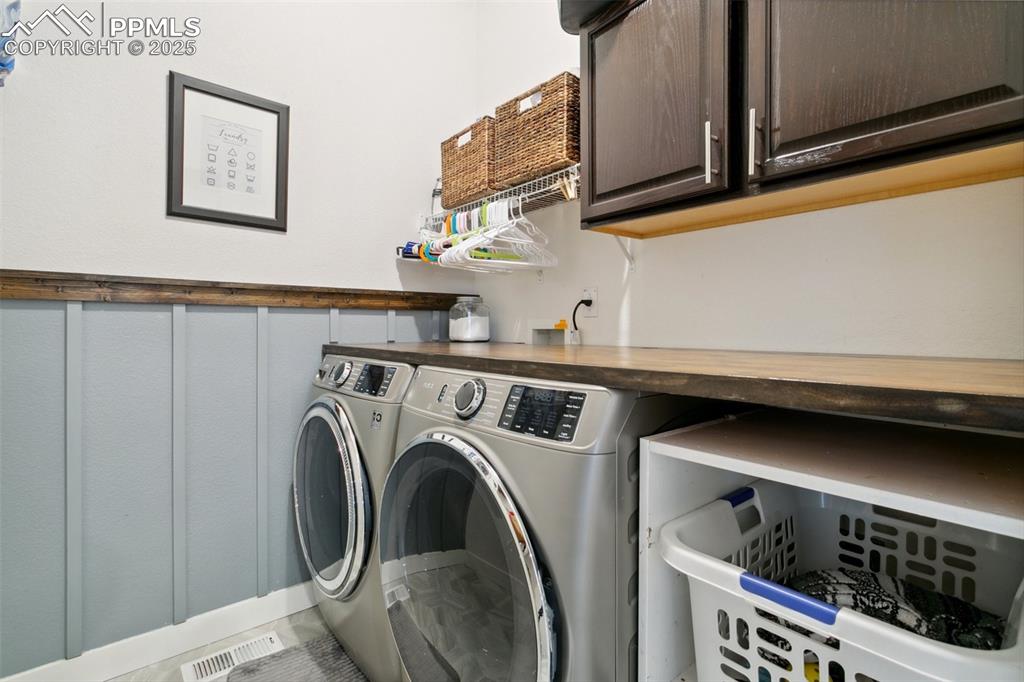 12912 Fishers Island Road Peyton, CO 80831 - Photo 14 of 45 a utility room with dryer and washer