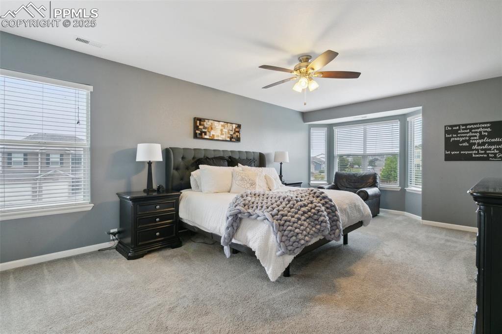 12912 Fishers Island Road Peyton, CO 80831 - Photo 15 of 45 a bedroom with a bed dresser and a window