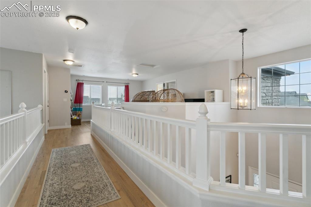 12912 Fishers Island Road Peyton, CO 80831 - Photo 20 of 45 a bedroom with furniture and white wooden floor