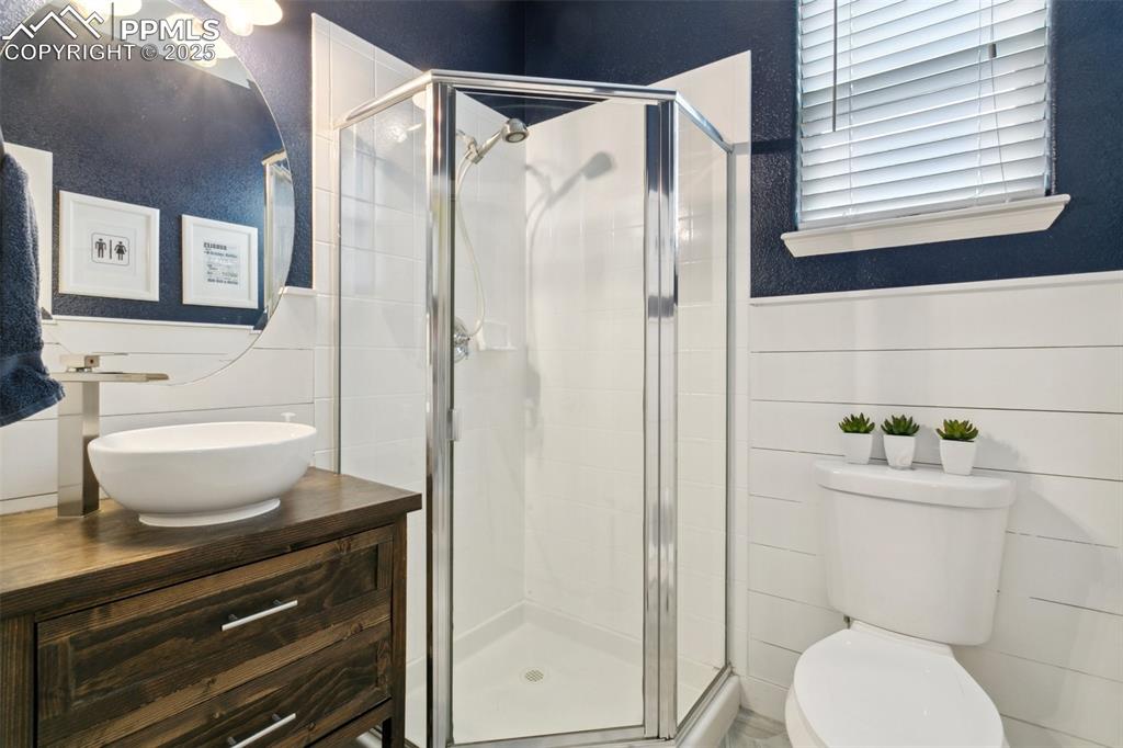 12912 Fishers Island Road Peyton, CO 80831 - Photo 23 of 45 a bathroom with a toilet and a shower