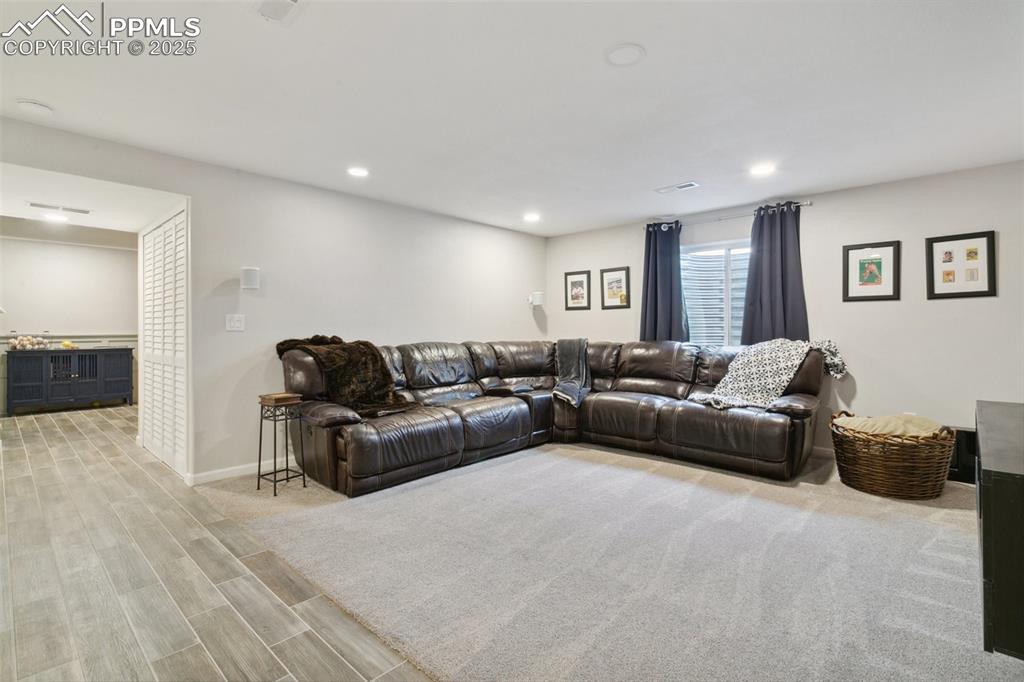 12912 Fishers Island Road Peyton, CO 80831 - Photo 27 of 45 a living room with furniture and a couch