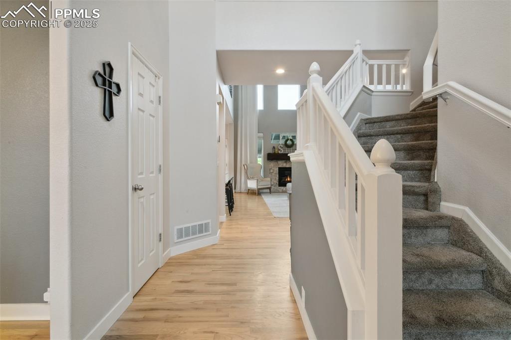 12912 Fishers Island Road Peyton, CO 80831 - Photo 3 of 45 a view of entryway and hall with wooden floor