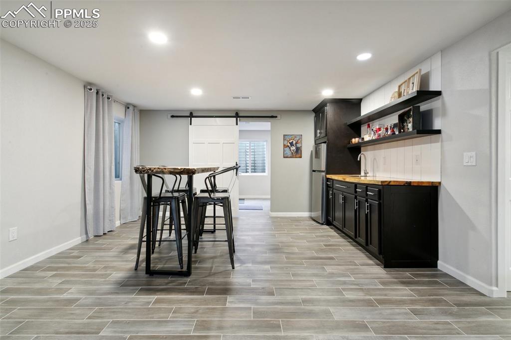 12912 Fishers Island Road Peyton, CO 80831 - Photo 31 of 45 a view of a chairs and table in a room