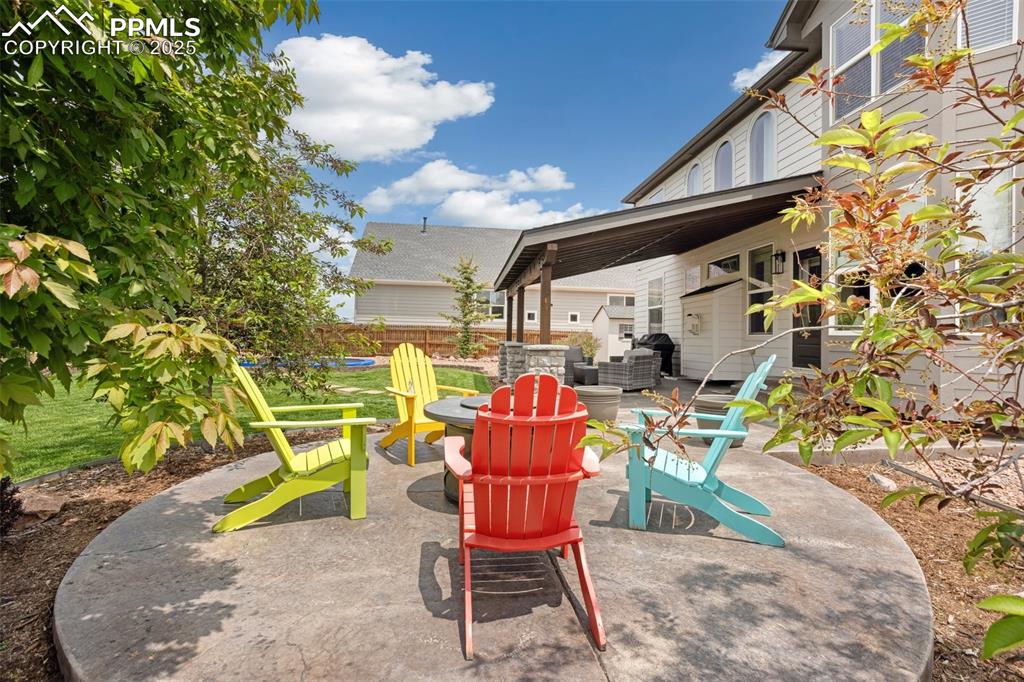 12912 Fishers Island Road Peyton, CO 80831 - Photo 38 of 45 a view of a chairs and table in the patio