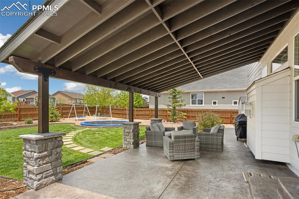 12912 Fishers Island Road Peyton, CO 80831 - Photo 39 of 45 a view of a porch with furniture and garden