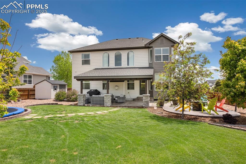 12912 Fishers Island Road Peyton, CO 80831 - Photo 40 of 45 a view of a house with a yard porch and sitting area