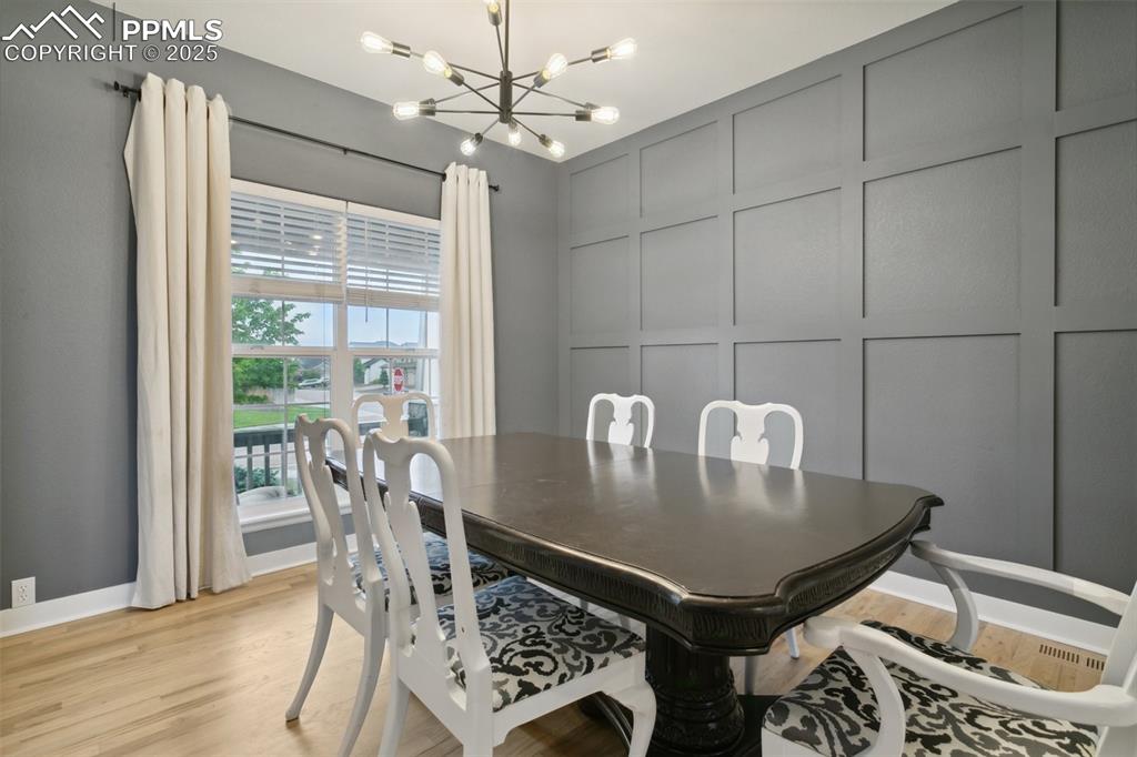 12912 Fishers Island Road Peyton, CO 80831 - Photo 4 of 45 a view of a dining room with furniture and chandelier