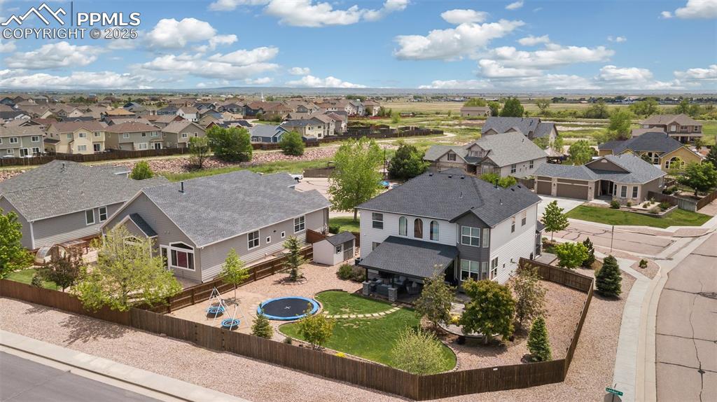 12912 Fishers Island Road Peyton, CO 80831 - Photo 41 of 45 an aerial view of residential houses with outdoor space and ocean view
