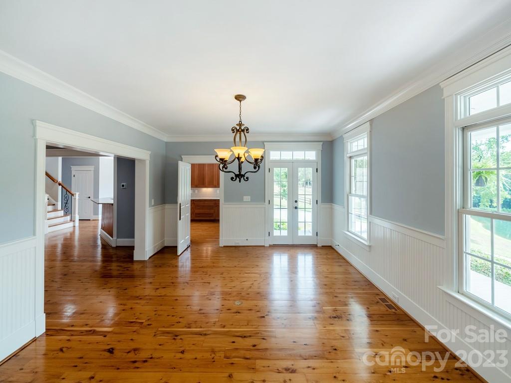 14707 June Washam Road Davidson, NC 28036 - Photo 14 of 48 a view of a room with wooden floor fireplace and windows