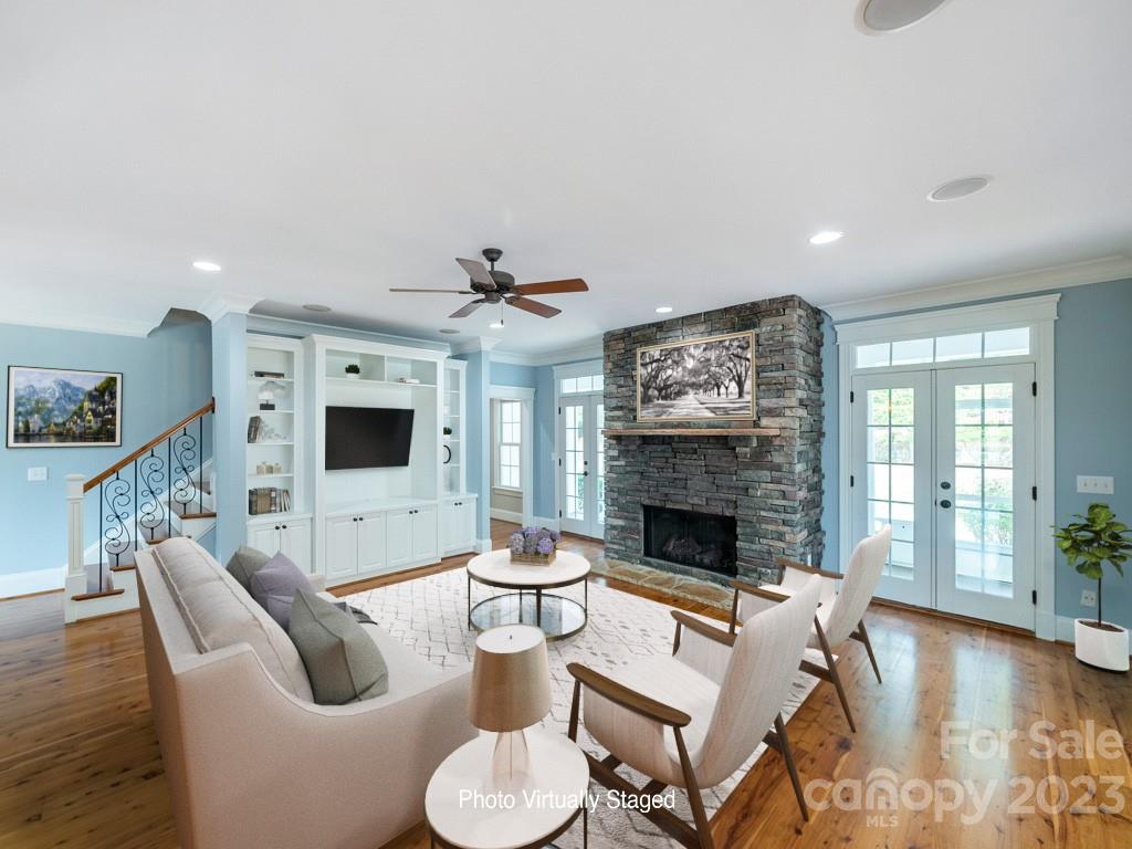 14707 June Washam Road Davidson, NC 28036 - Photo 17 of 48 a living room with furniture and a fireplace