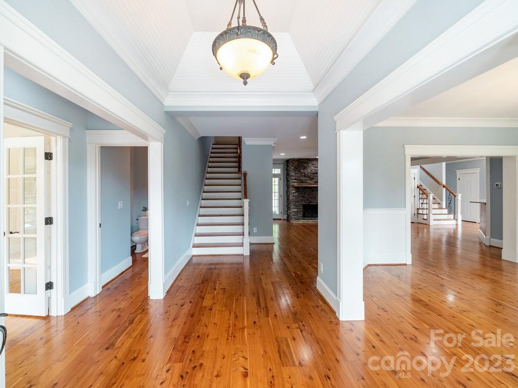 14707 June Washam Road Davidson, NC 28036 - Photo 25 of 48 a view of a room with wooden floor and stairs