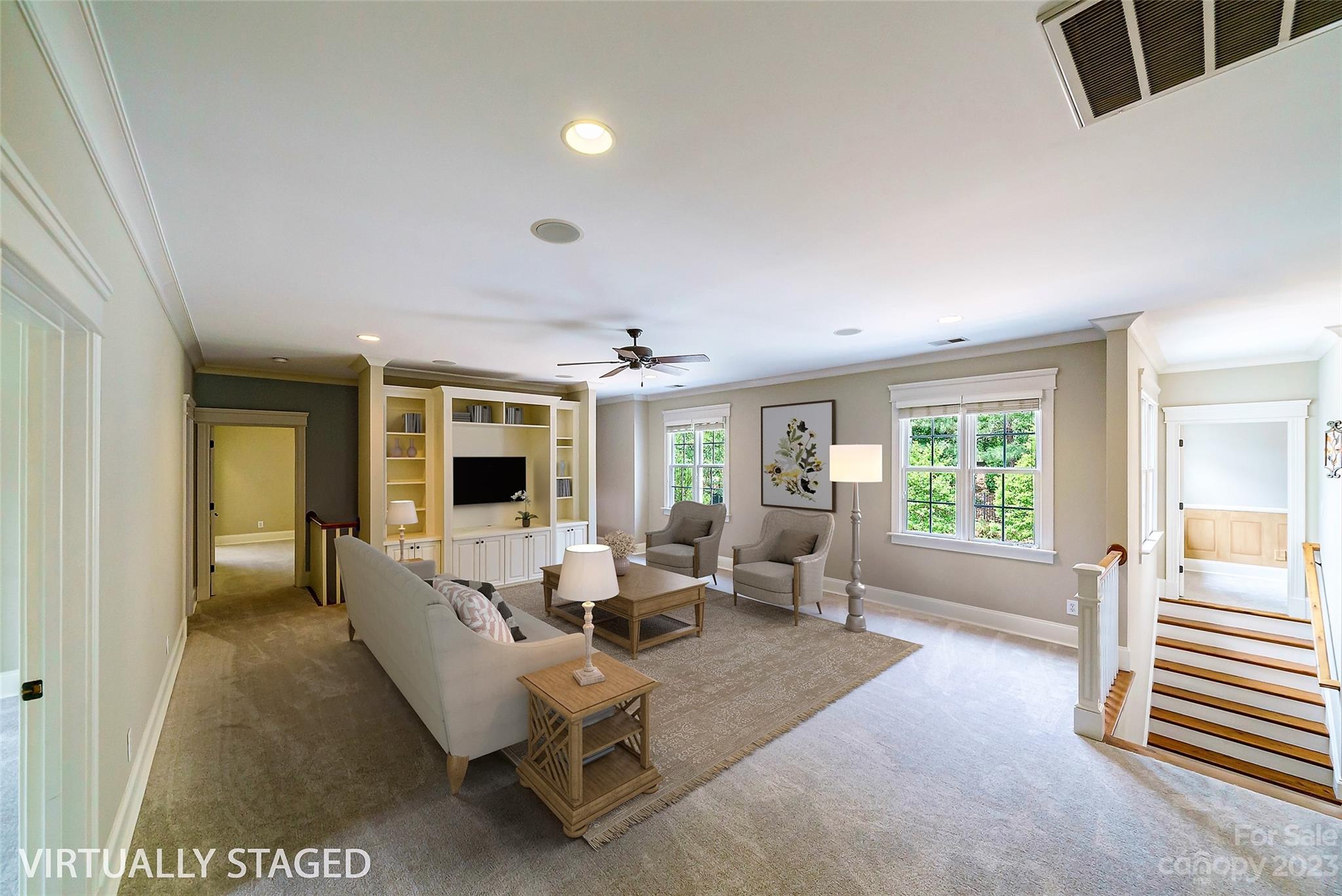 14707 June Washam Road Davidson, NC 28036 - Photo 27 of 48 a living room with furniture and a flat screen tv
