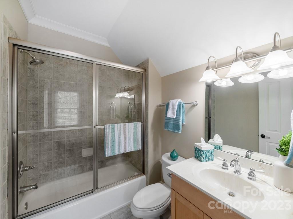 14707 June Washam Road Davidson, NC 28036 - Photo 29 of 48 a bathroom with a sink vanity mirror and toilet