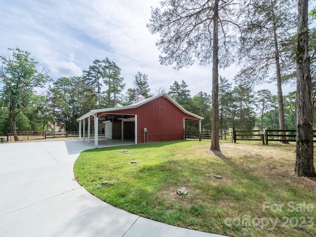 14707 June Washam Road Davidson, NC 28036 - Photo 32 of 48 a house with trees in the background