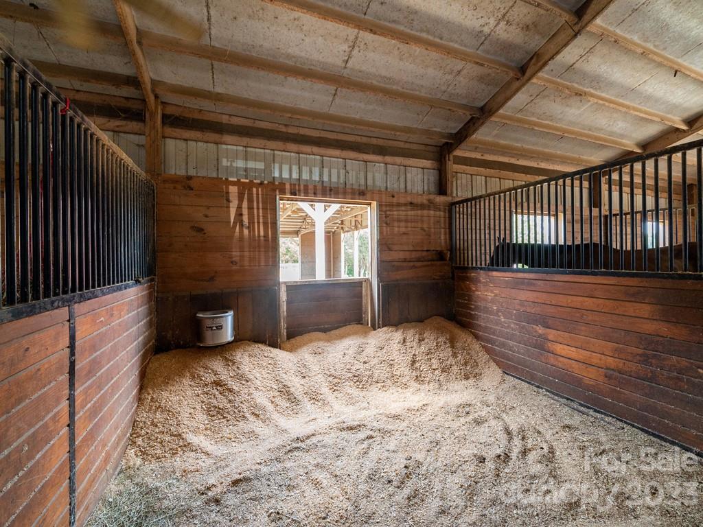 14707 June Washam Road Davidson, NC 28036 - Photo 40 of 48 a view of a hallway with wooden floor and fence
