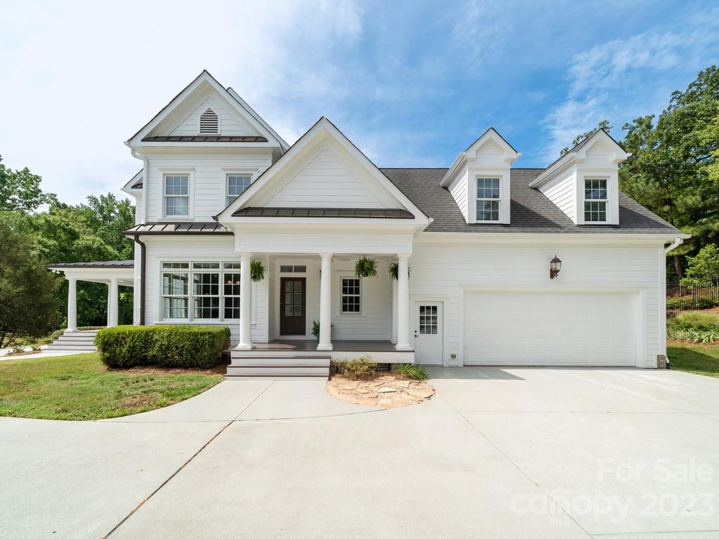 14707 June Washam Road Davidson, NC 28036 - Photo 4 of 48 a front view of a house with a yard