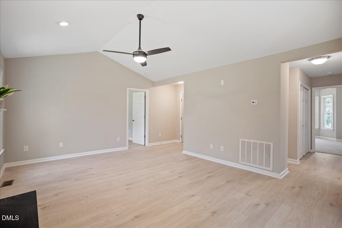 31 Fieldview Court Angier, NC 27501 - Photo 4 of 25 a view of an empty room with a ceiling fan