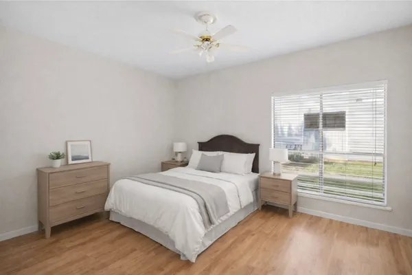 a bedroom with a bed and a window
