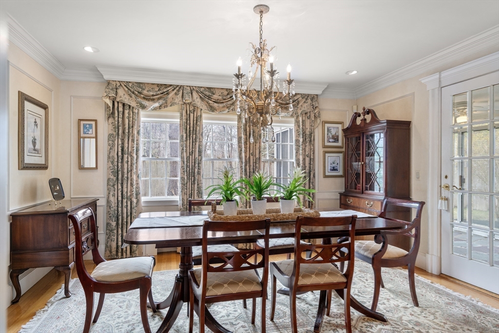 24 Wyndmere Road Milton, MA 02186 - Photo 11 of 37 a view of a dining room with furniture and chandelier