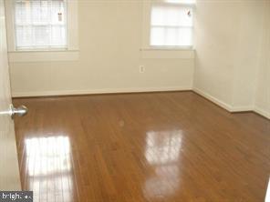 1456 Corcoran Street Northwest, Unit 1 Washington, DC 20009 - Photo 3 of 12 Open living room with wood floors