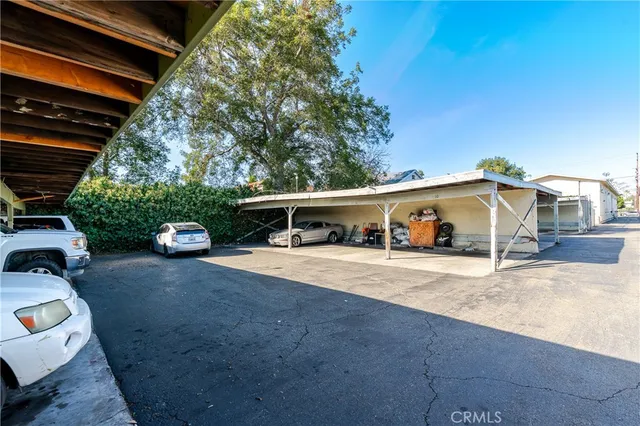 a view of parking garage with cars parked
