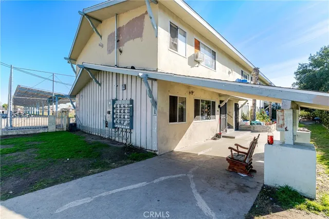 a front view of a building with an plants