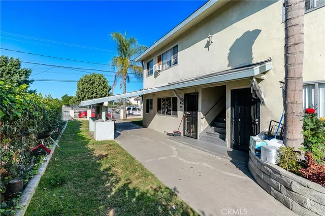 a view of backyard with wheel chair and potted plants