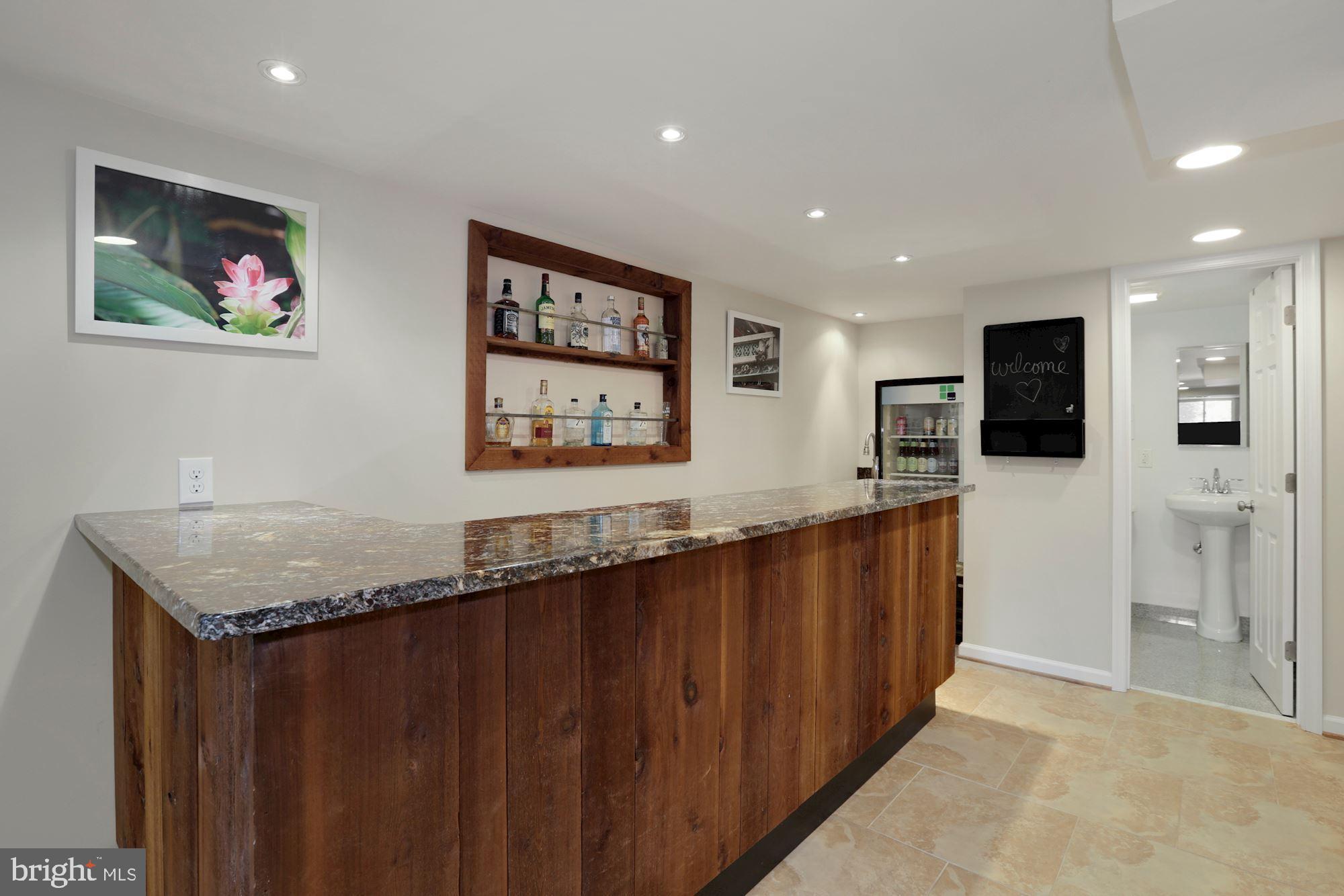 10006 Markham Street Silver Spring, MD 20901 - Photo 23 of 36 Custom Bar with Wine Refrigerator and Granite
