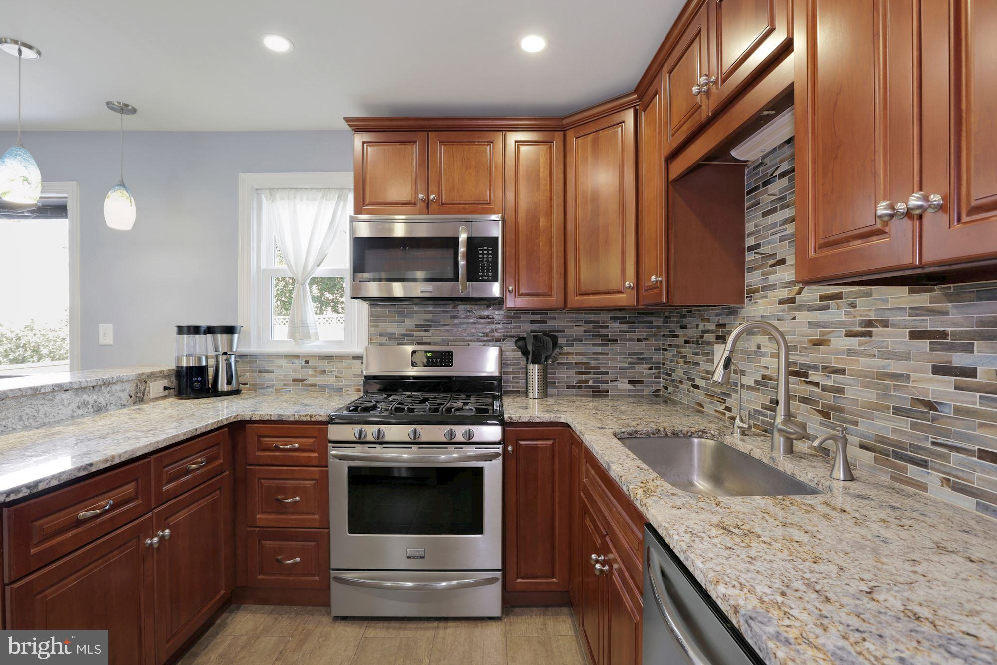 10006 Markham Street Silver Spring, MD 20901 - Photo 7 of 36 Granite Countertops and Designer Backsplash