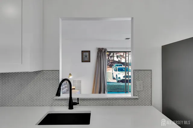 a bathroom with a sink and a window