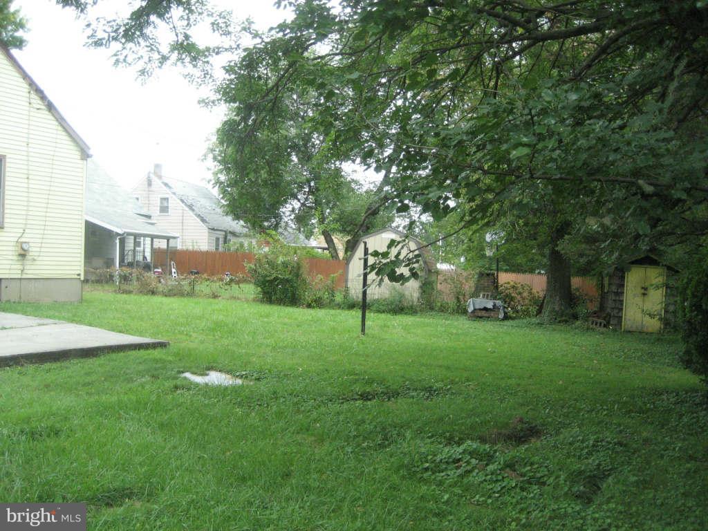 7413 Marston Road Baltimore, MD 21207 - Photo 16 of 16 a view of a house with a backyard