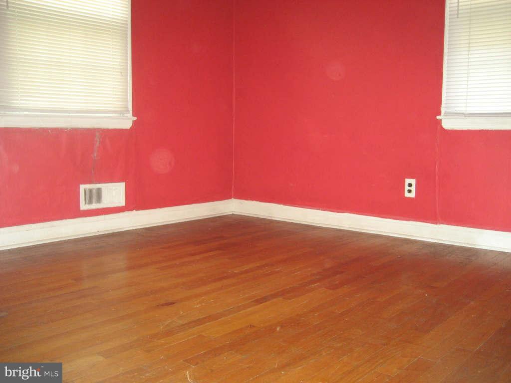 7413 Marston Road Baltimore, MD 21207 - Photo 7 of 16 a view of an empty room with window