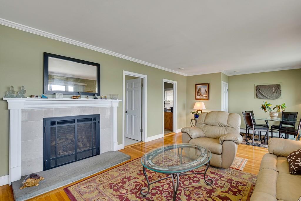 15 Greycliff Road Brighton, MA 02135 - Photo 13 of 41 a living room with furniture and a fireplace