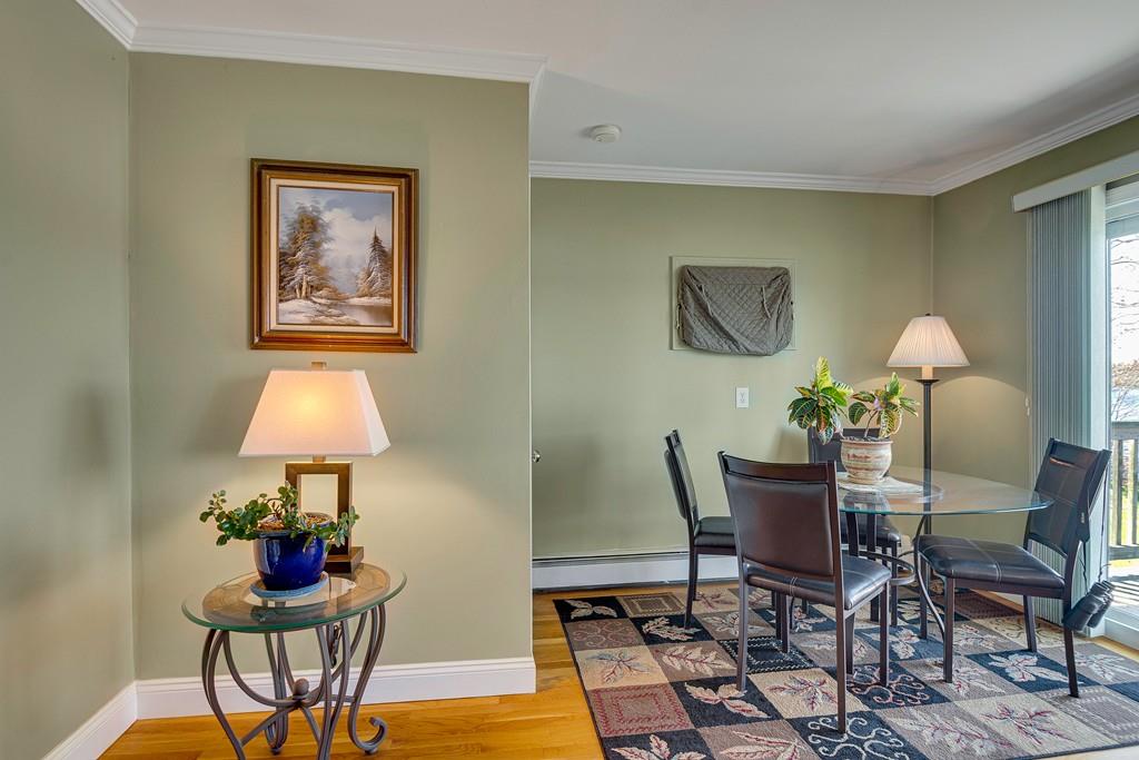 15 Greycliff Road Brighton, MA 02135 - Photo 14 of 41 a view of a dining room with furniture and a chandelier