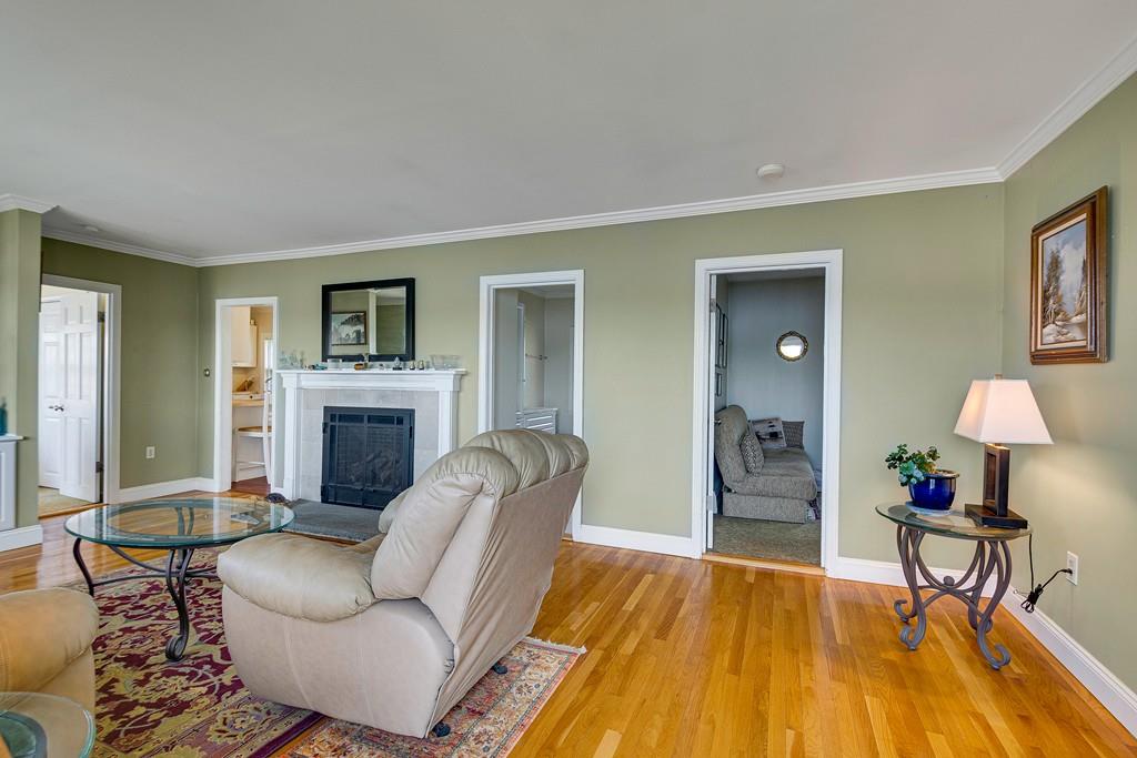 15 Greycliff Road Brighton, MA 02135 - Photo 15 of 41 a living room with furniture and a fireplace