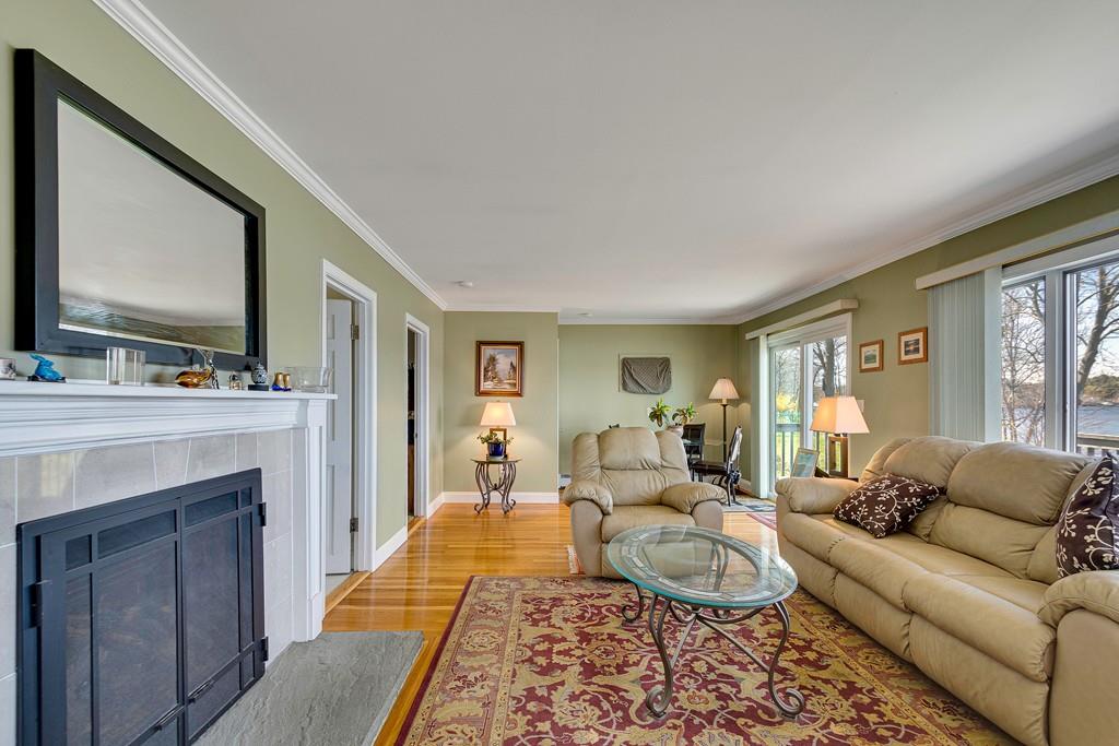 15 Greycliff Road Brighton, MA 02135 - Photo 9 of 41 a living room with furniture and a fireplace