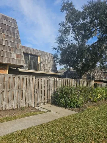 a view of a lake with houses in the back