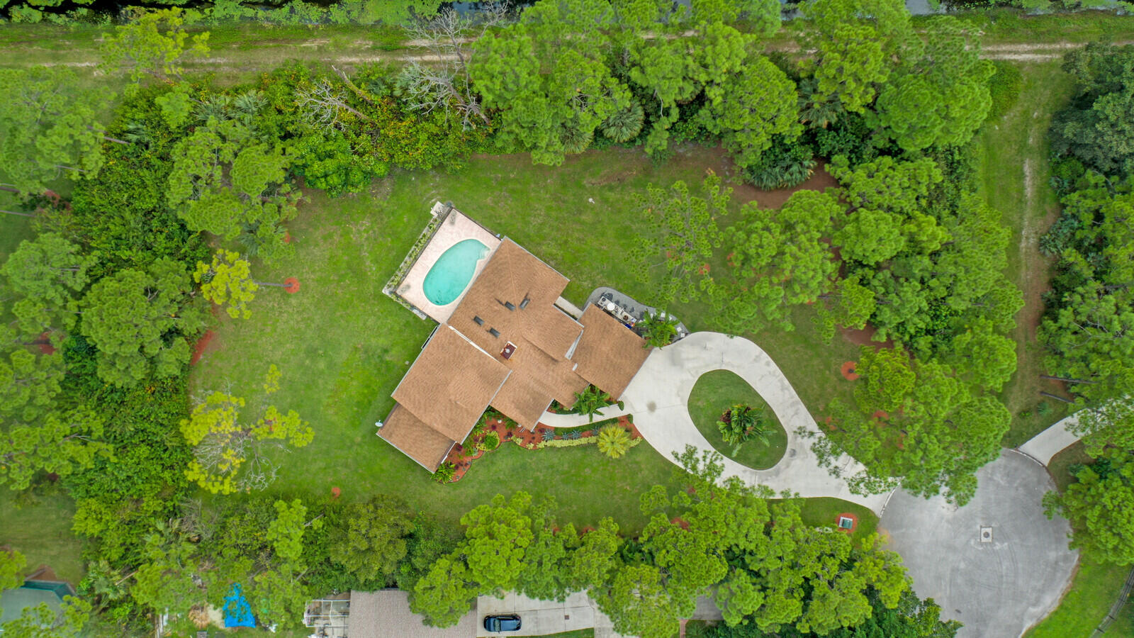 17520 Bridle Court Jupiter, FL 33478 - Photo 1 of 35 an aerial view of a house with a yard and lake view