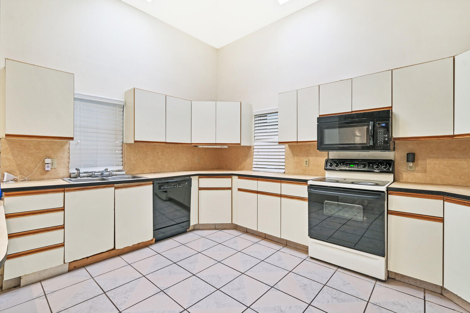 17520 Bridle Court Jupiter, FL 33478 - Photo 16 of 35 a kitchen with granite countertop cabinets stainless steel appliances and a sink