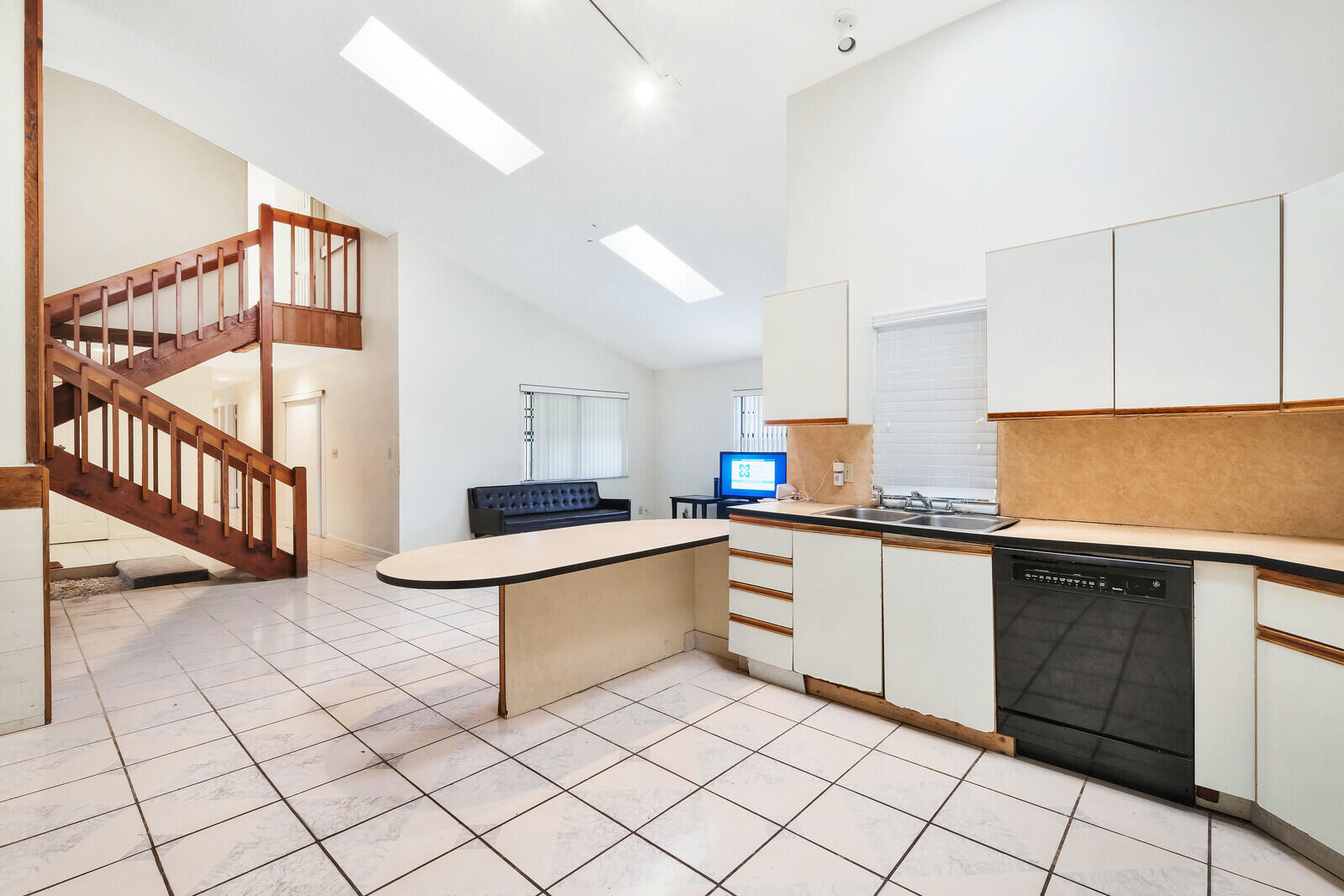 17520 Bridle Court Jupiter, FL 33478 - Photo 17 of 35 a kitchen with white cabinets a sink and white appliances