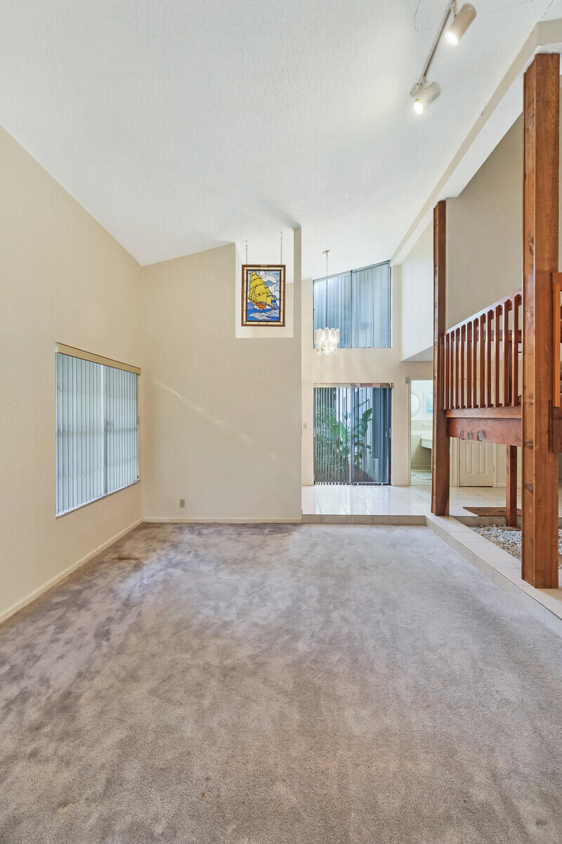 17520 Bridle Court Jupiter, FL 33478 - Photo 21 of 35 a view of an empty room with a window