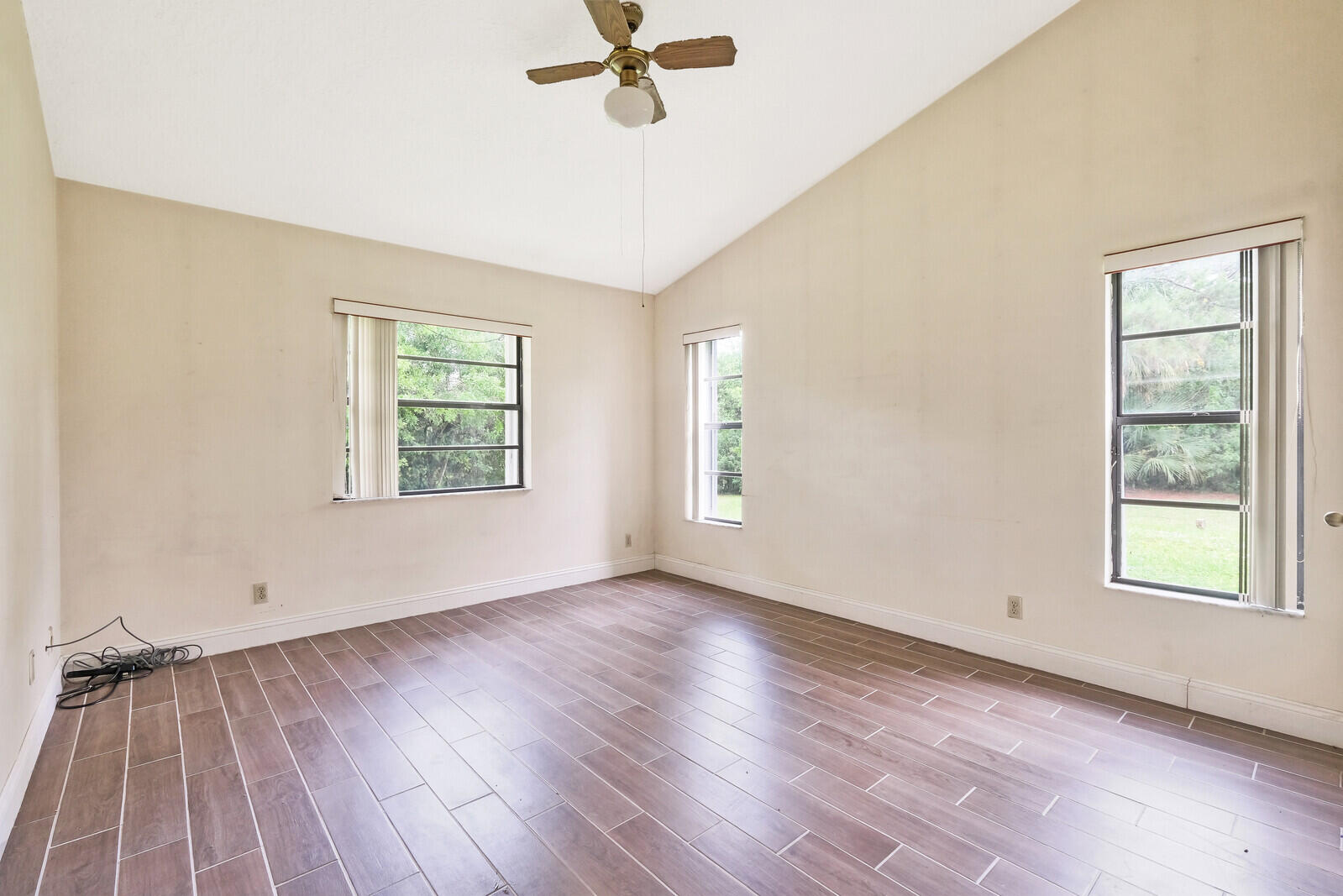 17520 Bridle Court Jupiter, FL 33478 - Photo 23 of 35 wooden floor in an empty room with a window